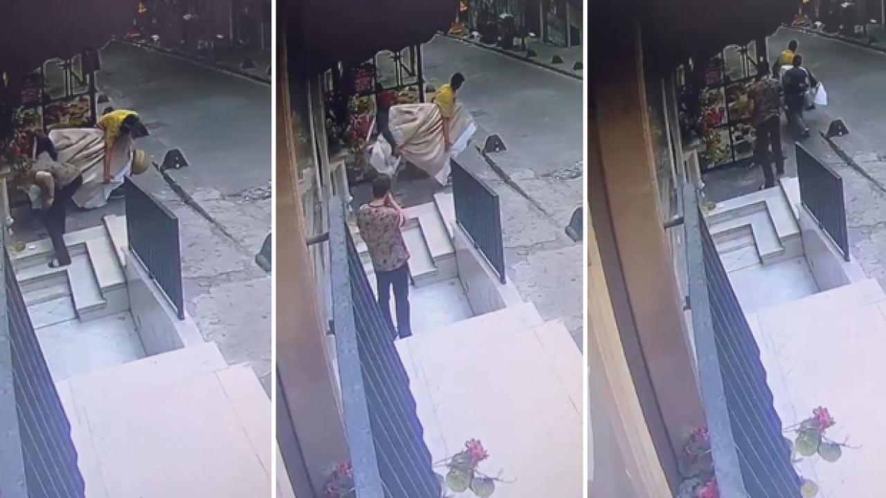 Hırsız çaldığı televizyonu taşımakta zorlanınca esnaf yardım etti